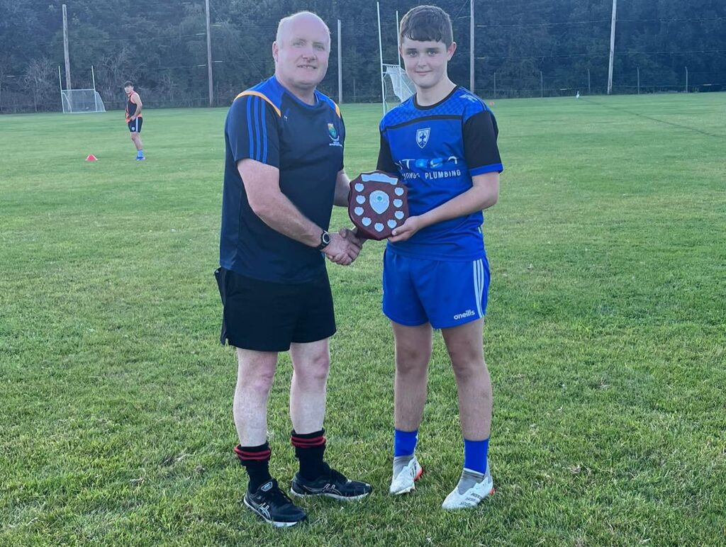 Alfie-McDonald-Division-1-League-Trophy-with-Referee-Pat-Dunne